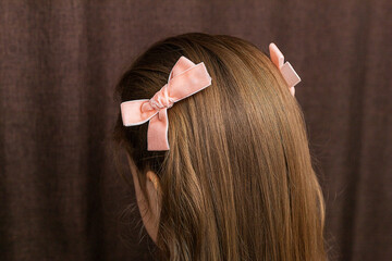 women's hands weave pigtails for a little girl, children's hairstyles at home, a spikelet of hair - obrazy, fototapety, plakaty