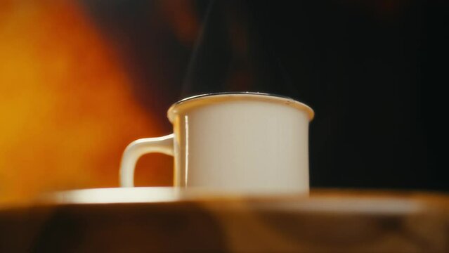 Hot coffee mug in the morning. Delicious drink to start the day. Steaming hot beverage.