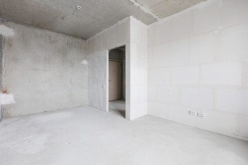 interior of the apartment without decoration in gray colors. rough finish