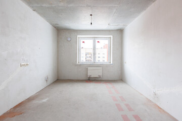 interior of the apartment without decoration in gray colors. rough finish