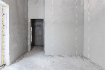 interior of the apartment without decoration in gray colors. rough finish