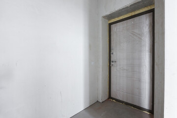 interior of the apartment without decoration in gray colors. rough finish