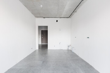 interior of the apartment without decoration in gray colors. rough finish