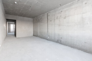 interior of the apartment without decoration in gray colors. rough finish