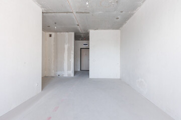 interior of the apartment without decoration in gray colors. rough finish