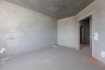 interior of the apartment without decoration in gray colors. rough finish