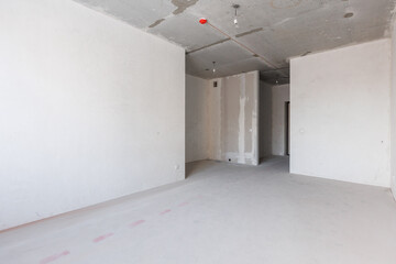 interior of the apartment without decoration in gray colors. rough finish
