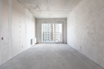 interior of the apartment without decoration in gray colors. rough finish