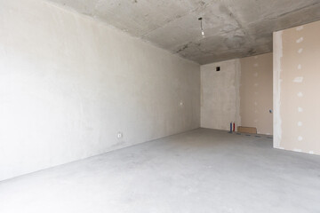 interior of the apartment without decoration in gray colors. rough finish