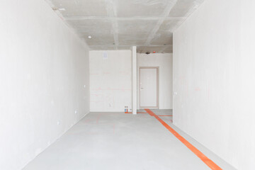 interior of the apartment without decoration in gray colors. rough finish