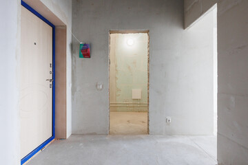interior of the apartment without decoration in gray colors. rough finish