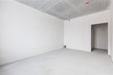 interior of the apartment without decoration in gray colors. rough finish