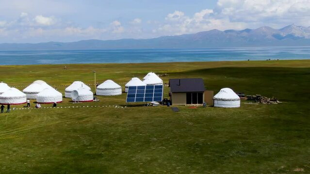 Aerial view of nomadic yurt camp on a meadow