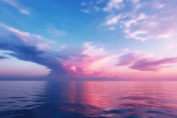 A pink and blue sky over the ocean