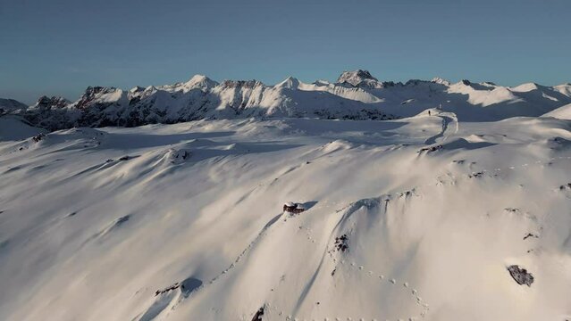 Snow covered mountains, Alps in Switzerland aerial drone footage