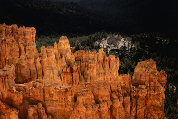 Hoodoos On The Rim Glow Orange With the Under The Rim Trail In The Distance