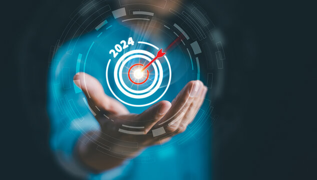 Start calendar 2024 plan concept. Businessman setup objective plan action target, business trend 2024 strategy. Goal challenge person planning growth New year 2024, digital marketing, profit income