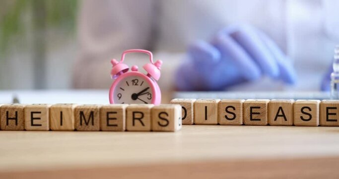 Word on cubes diagnosis of Alzheimer disease in elderly person. Doctor consultation on Alzheimer disease treatment concept