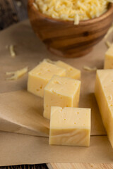 yellow semi-hard cheese with holes