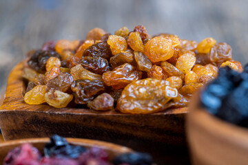 dried golden-colored raisins on the table