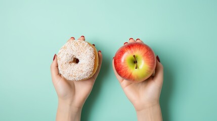 top view of healthy versus unhealthy with a woman's hand holding a donut and green apple on a serene blue pastel background. Perfect for promoting a balanced and healthy lifestyle - obrazy, fototapety, plakaty