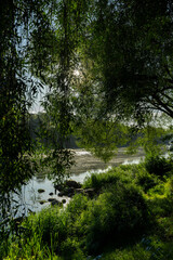 a wide river at dawn in the autumn season