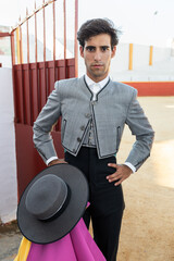Confident matador standing near arena