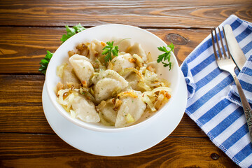 Ukrainian dumplings stuffed with potatoes and mushrooms, served with fried onions.
