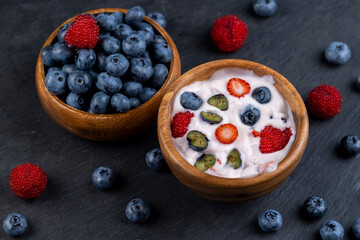 ripe blueberry berries and yogurt with blueberry and blueberry flavor