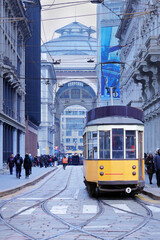 centro città di milano con tram giallo in italia, town center of milan with yellow streetcar in...