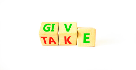 Give or take symbol. Concept word Give or Take on wooden cubes. Beautiful white table white background. Business give or take concept. Copy space.