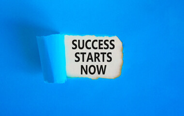 Success starts now symbol. Concept word Success starts now on beautiful white paper. Beautiful blue...