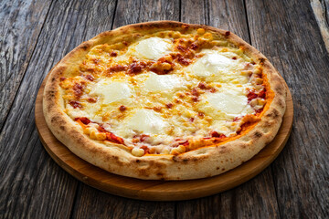 Margherita Pizza with tomato sauce and mozzarella cheese  on wooden background
