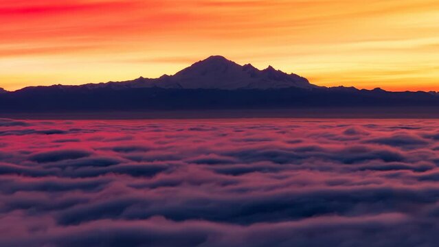 Cinemagraph Continuous Loop Animation. Colorful Sunrise with Vancouver covered in Fog and Mt Baker in Background. Cypress Lookout, West Vancouver, BC, Canada.