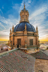 Baroque bell tower and dome of the La Clerecia building at sunset in the city of Salamanca, Spain.