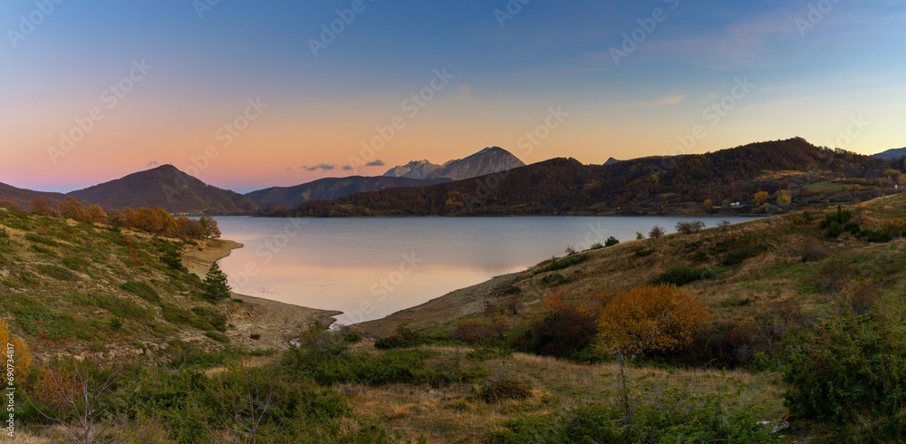 Poster panorama landscape of Lago di Campotosto in Abruzzo at sunset