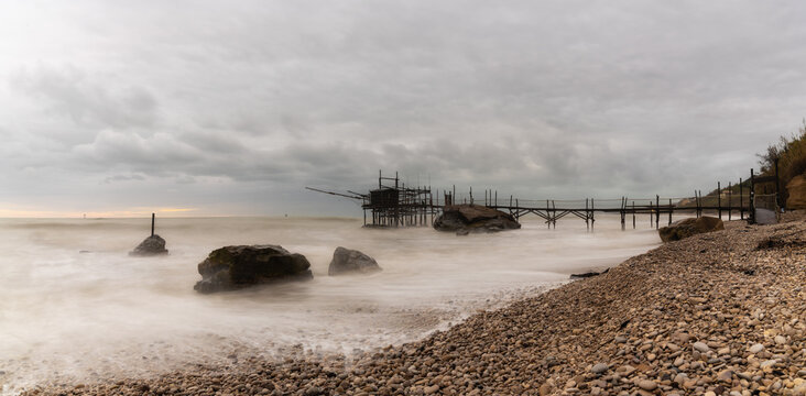 Trabocco Punto Le Morge on a rainy day under a cloudy sky long exposure