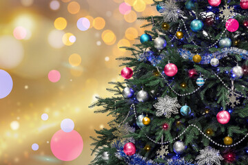Christmas tree decorated with pink, light blue and silver festive balls against blurred background, bokeh effect. Space for text