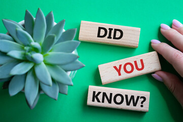 Did you know symbol. Wooden blocks with words Did you know. Businessman hand. Beautiful green...