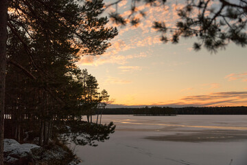 winter lake with snow at sunset