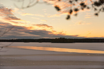 sunset over a lake in winter