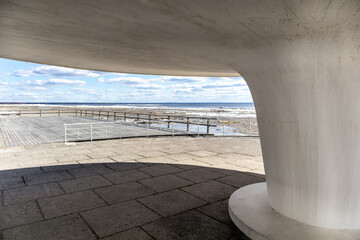 
View of the Baltic Sea with a white concrete pillar as a roof in the foreground