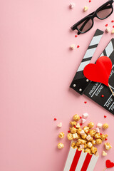 Valentine's cinema essentials: Vertical top view clapperboard, 3D glasses, popcorn, heart decor, marshmallow, and sprinkles on a lovely pastel pink surface. Elevate your romantic movie night