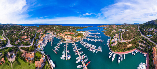 Italy, Sardegna island. Luxury resort  town Porto Cervo. Marina with sailing boats, aerial drone...