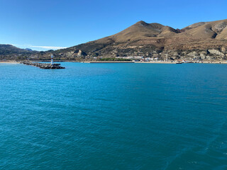 Fototapeta na wymiar Panoramic view from the ferry on the island of Gokceada at Kuzulimani harbour, Canakkale, Turkey