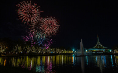 Fototapeta premium Suan Luang Rama IX Public Park, a resting place and landmark in Bangkok, Thailand, has a light show celebrating the Bangkok Flower Festival 