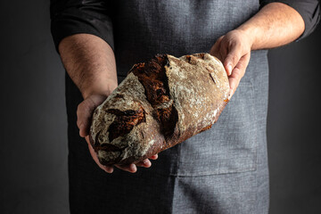 Fresh bread on table. healthy eating and traditional bakery on a dark background. banner, menu,...