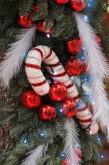 Fototapeten Fallen Christmas umbrella hanging with balls on Christmas pine branches  © ajcsm