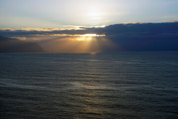Ocean. Waves, wind and clouds. Landscapes of Madeira. Surf. Horizon. Bright sky and clouds. Sunset.