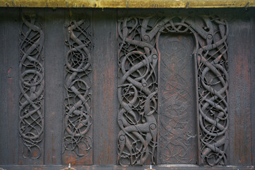Decorations on the wall of Urnes stave church in Ornes, Norway